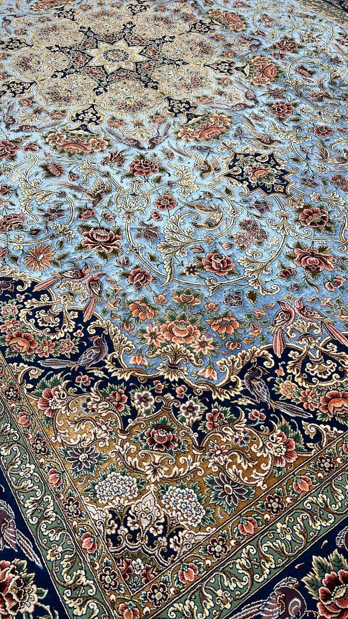 Hand-knotted wool and silk Persian carpet from Isfahan